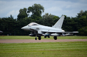 Fototapeta na wymiar Typhoon FGR4 fighter jet scramble, QRA is launched RAF fighter station. Lincolnshire. Russian aggression 