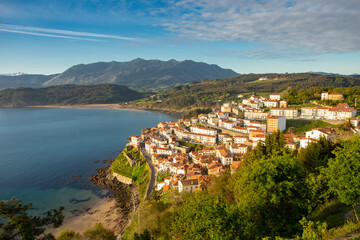 village of Lastres in Asturias, northern Spain. fishing village with the mountains in the background at sunrise. European tourism.