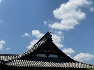 Fototapeta na wymiar The beautiful rooftop tiles and emblem of Japanese traditional temple house, in the old town of Tokyo “Yanaka”, year 2022 May 24th