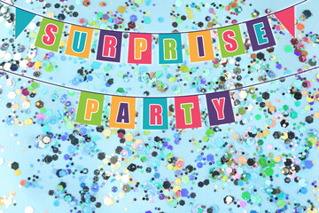 Surprise party. Bunting flags and shiny confetti on light blue background