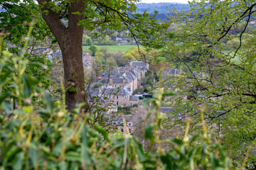 Scenic rooftops view through trees of the town below The Church of the Holy Rude in Stirling, Scotland
