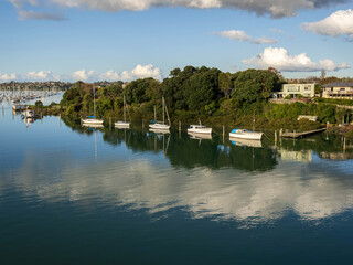 Aerial view of Tamaki river (Auckland, New Zealand) with moored boats
