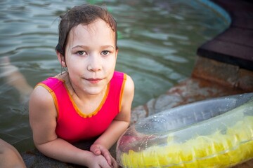 children indulge and play in the water of the hot spring during holidays and holidays undergoing treatments in the thermal pool