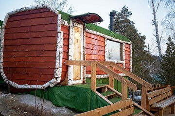 a wooden building in the forest, on the territory of a spa resort, a wood-fired sauna to warm up...
