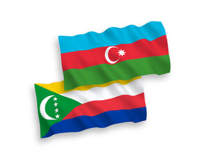 National vector fabric wave flags of Union of the Comoros and Azerbaijan isolated on white background. 1 to 2 proportion.