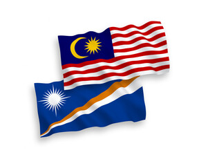 National vector fabric wave flags of Republic of the Marshall Islands and Malaysia isolated on white background. 1 to 2 proportion.