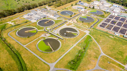 Aerial view of the tanks of a sewage and water treatment plant enabling the discharge and re-use of...