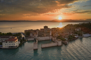 Sirmione sunset aerial view. Sunset over lake garda in Italy, drone view.