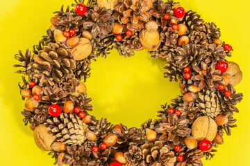 Autumn wreath of cones, nuts, and berries. Creative composition, the handmade
