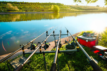 fishing rod and reel on river