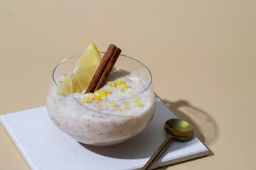Arroz con leche popular spanish dessert made with milkor  and sweeet rice y decorated with   lemon and Cinnamon