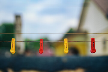 wet yellow and red clothespins