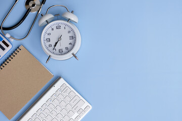 Office desk table with laptop computer and supplies. Top view with copy space, flat lay.