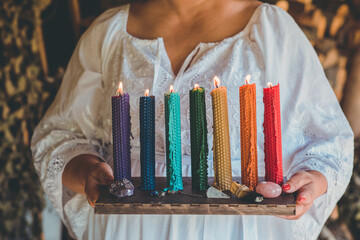 Energy healing, reiki session or chakra rituals with  candles. Woman wicca magic, new world,...