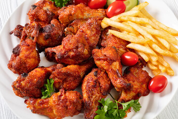 roast chicken wings with french fries and veggies