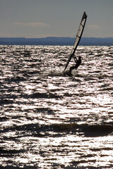 Windsurfing at overcasted sky Lake Balaton