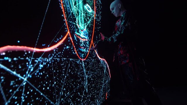 Man from the future communicates with artificial intelligence visualization. Abstract digital human face By Synticate.