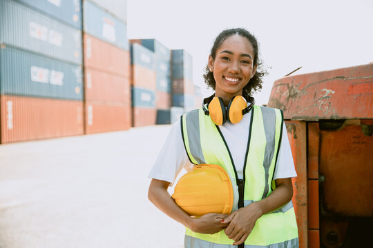 African teen black woman worker work in port cargo shipping portait happy smile