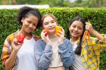 teen girl mix race happy smile with vegetables fresh from farm agriculture eating healthy concept