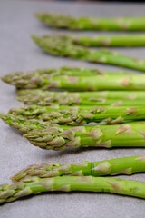 Green asparagus on a gray bockground. Seasonal fresh food