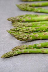 Green asparagus on a gray bockground. Seasonal fresh food