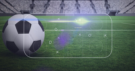 Image of game plan and soccer ball at stadium