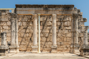 Fototapeta premium Reconstruction of the ruins of the White Synagogue where Jesus preached at Capernaum, Kfar Nahum, Capharnaum, next to the Sea of Galilee in Israel 