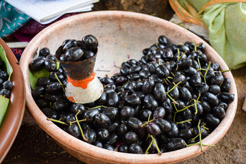 Stock photo of freshly picked home grown java plum or malabar plum fruit kept in a plastic...