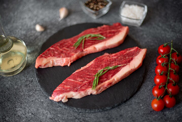 raw Picanha steak on stone background with spices