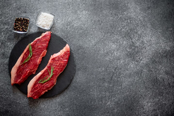 raw Picanha steak on stone background with spices with copy space for your text