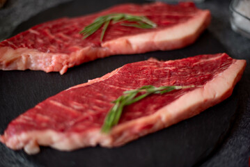 raw Picanha steak on stone background with spices