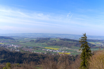 Obraz premium Aerial view over rural landscape seen from local mountain Uetliberg on a blue cloudy spring day. Photo taken April 21st, 2022, Zurich, Switzerland.