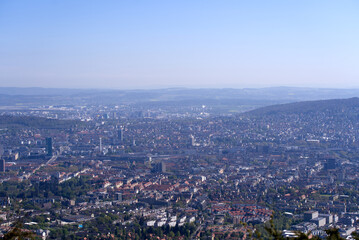Aerial view over City of Zürich on a beautiful spring day with blue cloudy sky background. Photo taken April 21st, 2022, Zurich, Switzerland.