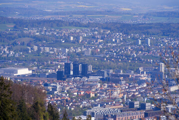 Aerial view over City of Zürich seen from local mountain Uetliberg on a sunny spring day. Photo taken April 21st, 2022, Zurich, Switzerland.