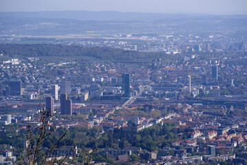Obraz premium Aerial view over City of Zürich seen from local mountain Uetliberg on a sunny spring day. Photo taken April 21st, 2022, Zurich, Switzerland.