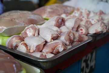 Almaty, Kazakhstan - 03.25.2022 : Chilled chicken legs laid out for sale in a hypermarket