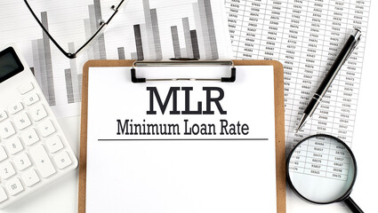 Paper with MLR - Minimum Loan Rate a table on charts, business concept