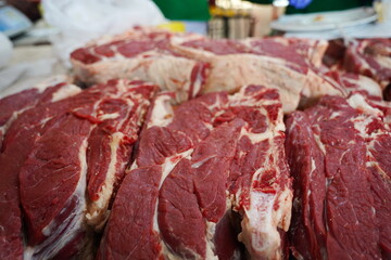 Almaty, Kazakhstan - 03.25.2022 : Different parts of meat are prepared for sale on the open market.