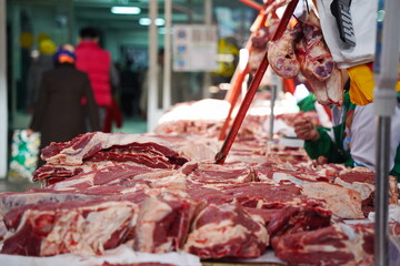Almaty, Kazakhstan - 03.25.2022 : Different parts of meat are prepared for sale on the open market.