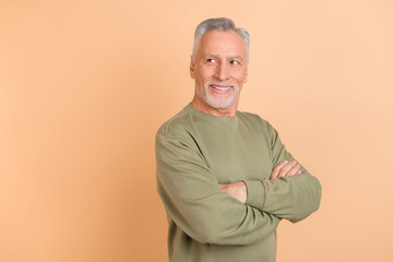 Profile side photo of senior cheerful man folded hands wonder look empty space isolated over beige color background