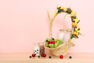 Photo of dairy products over wooden table. Symbols of jewish holiday - Shavuot