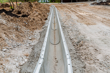 Drainage system for wastewater on the road. Construction of a canal for the discharge of rainwater....