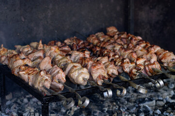 Meat kebabs on flaming grill