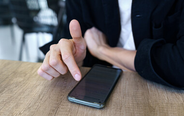 Close up of man tapping phone screen, searching the internet, scrolling social media feed. - obrazy, fototapety, plakaty