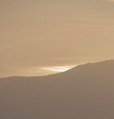 Abstract mountain scene with ocean background at sunset, Snowdonia Wales UK