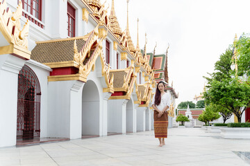 young asian woman walking meditation Sanctuary Ratchanatdaram bangkok