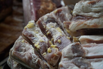 Almaty, Kazakhstan - 03.25.2022 : Smoked meat products are laid out for sale in an open market