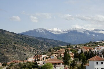 Fototapeta na wymiar View of the Granada town of Vélez de Benaudalla (Spain) with Sierra Nevada in the background