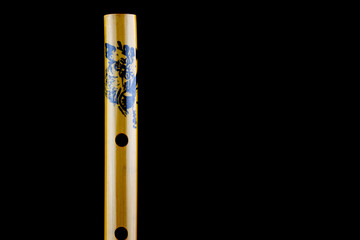 Chinese Bamboo Flute Closeup View on a Black Background