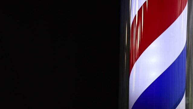 Barber shop vintage pole. copyspace Barbershop. Barber shop pole in red white and blue with lightbulb on top